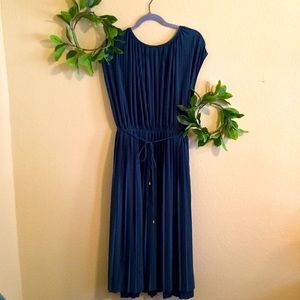 Dark teal. Formal dress.Worn once. Beautiful, semi silky material.Pleated style.